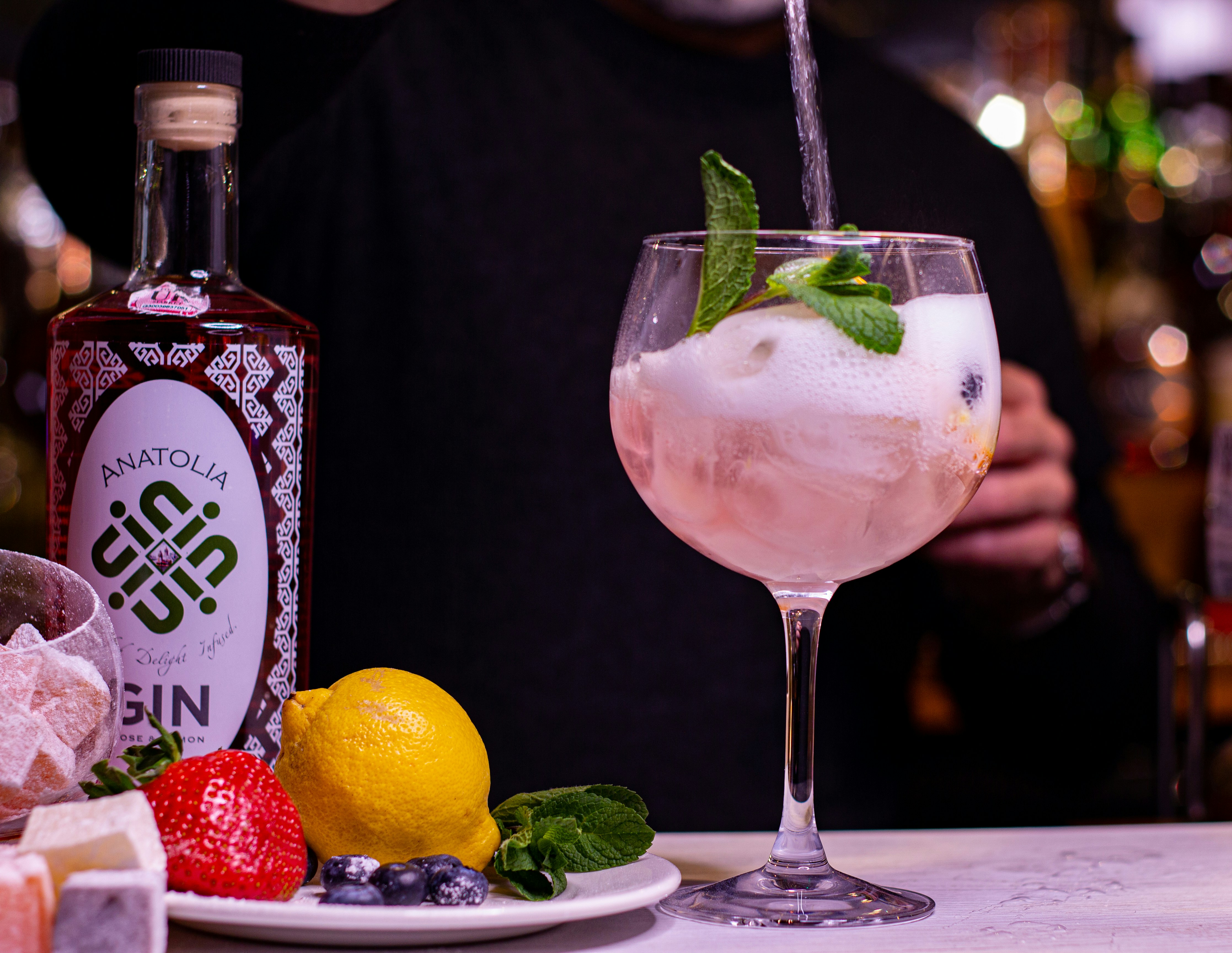 clear wine glass with sliced lemon and strawberry