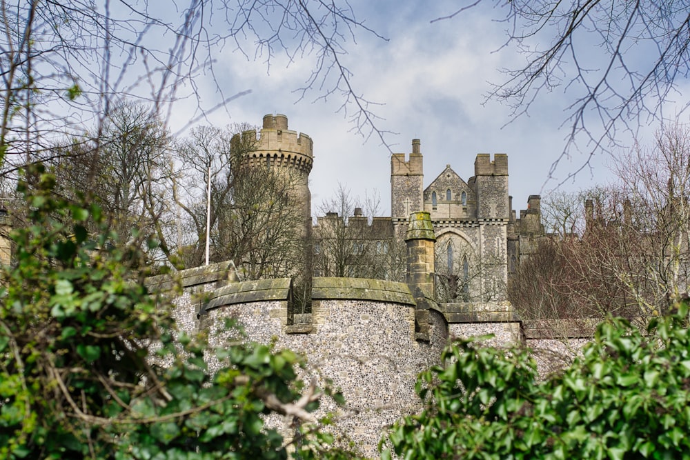 gray concrete castle under white clouds during daytime