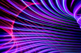 Vibrant neon amber and gold glowing lines connecting digital marketing elements on a dark background.