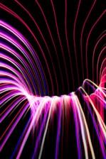 Vibrant magenta energy waves flowing gently around a peaceful meditation setting.