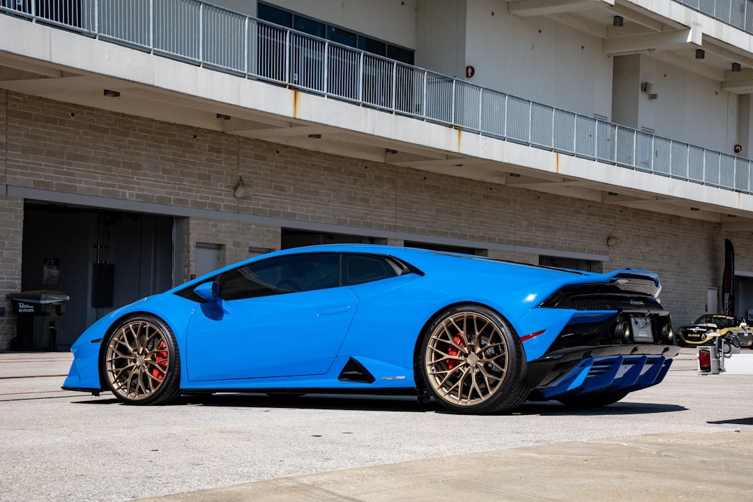 blue ferrari 458 italia parked on parking lot