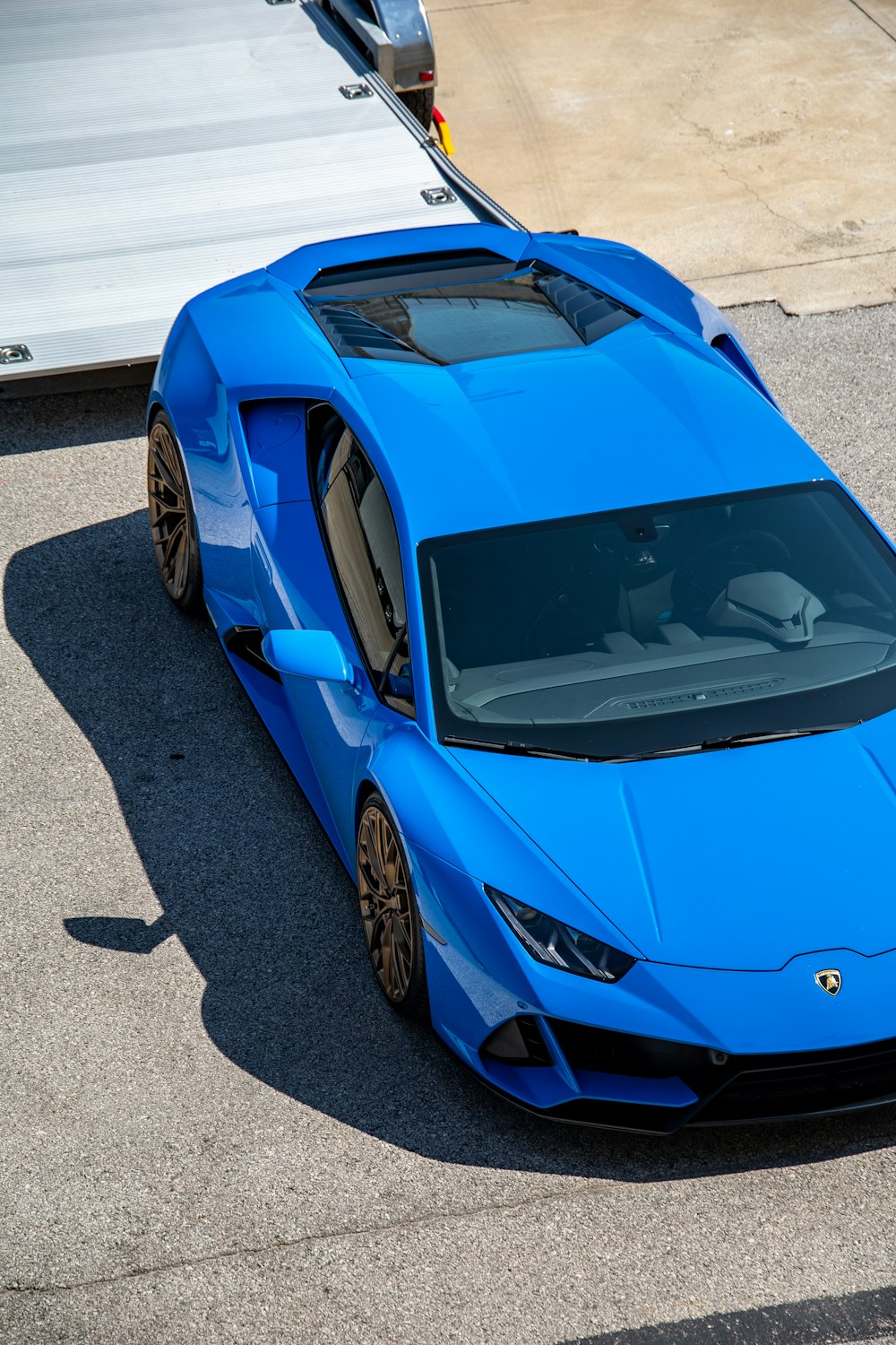 blue lamborghini aventador on road during daytime