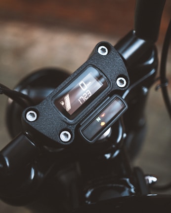Close-up of a sleek motorcycle dashboard with modern controls and digital display