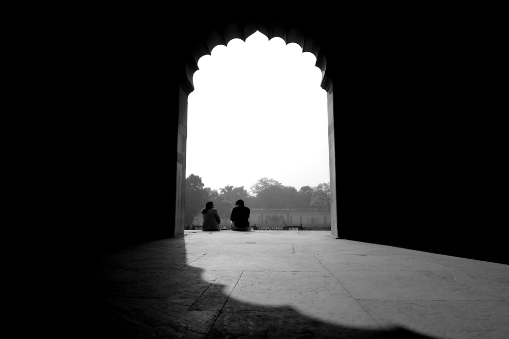 silhouette of people walking on hallway