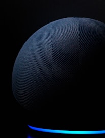 blue round textile on black background