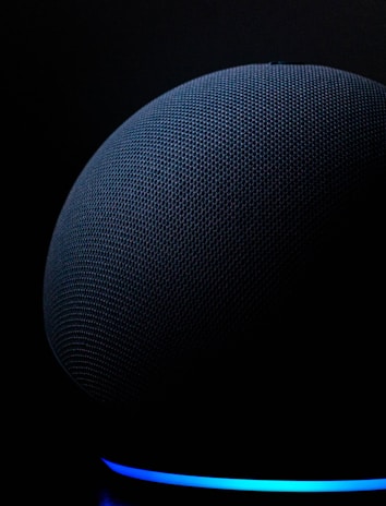 blue round textile on black background