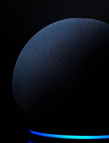 blue round textile on black background