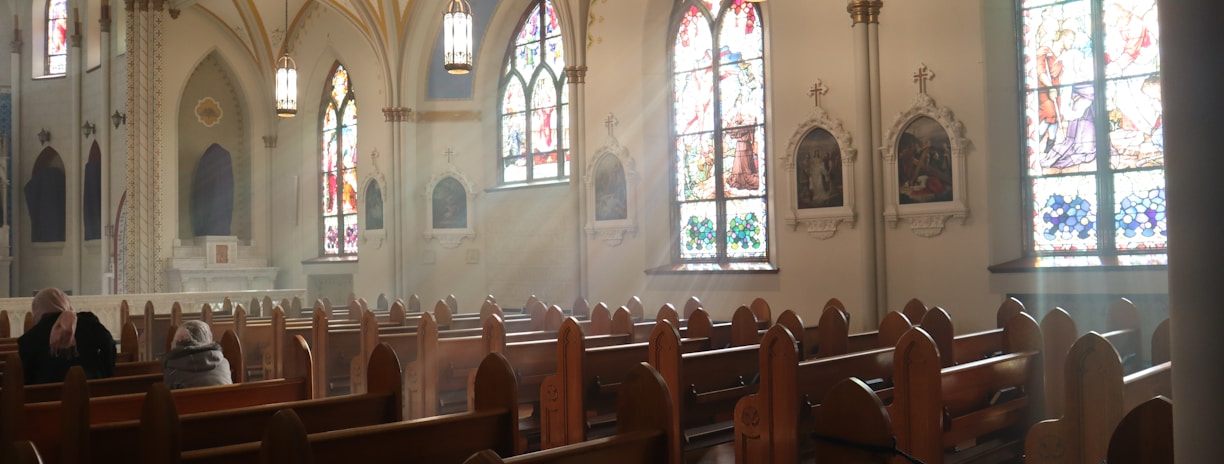 brown wooden chairs inside church