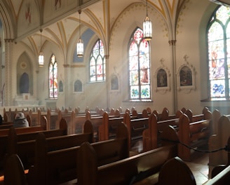 brown wooden chairs inside church