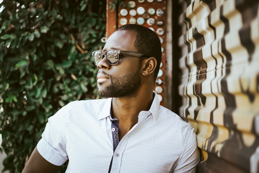 man in white button up shirt wearing black framed eyeglasses