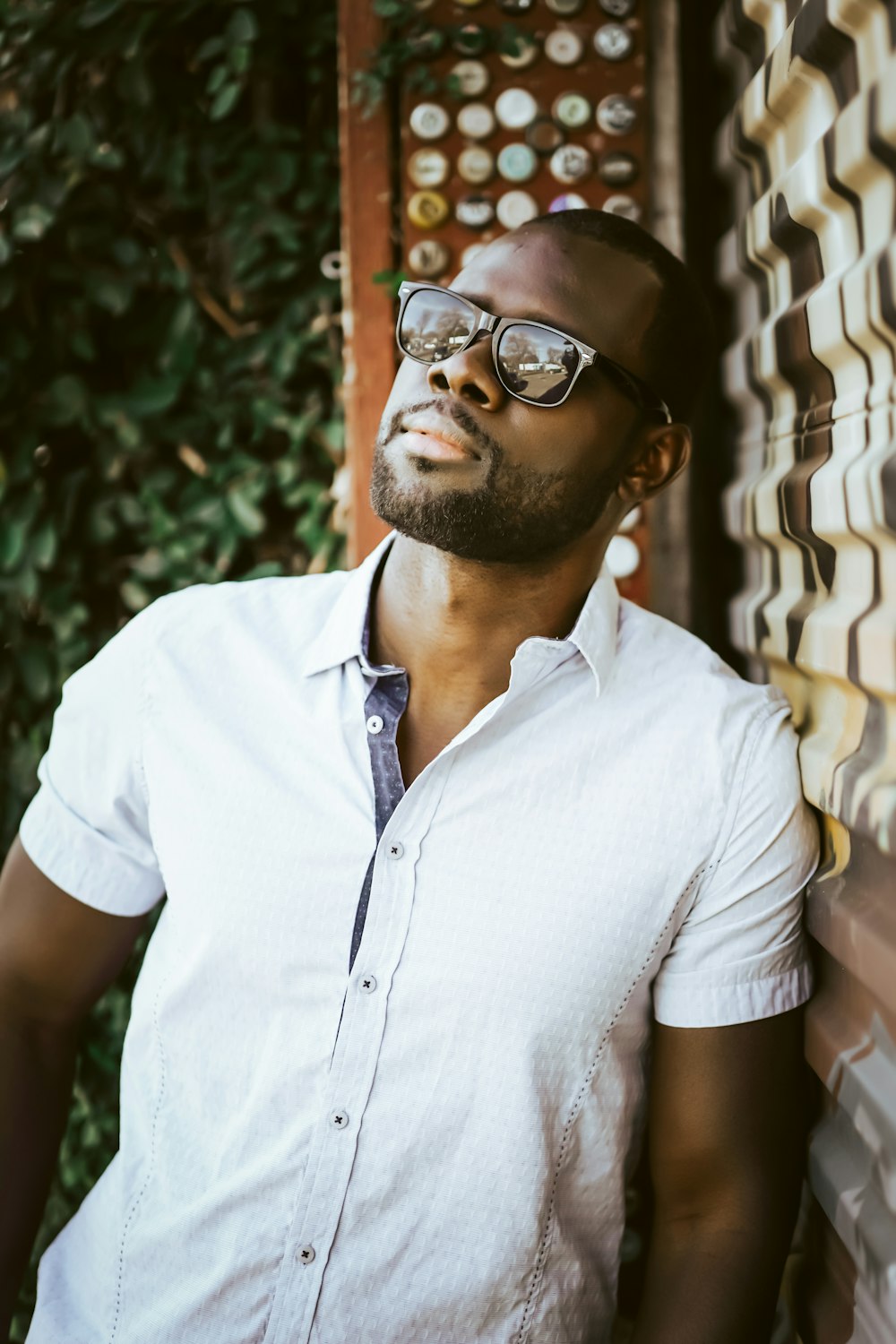 man in white button up shirt wearing black framed eyeglasses