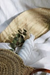 white and green plastic bottle on white textile