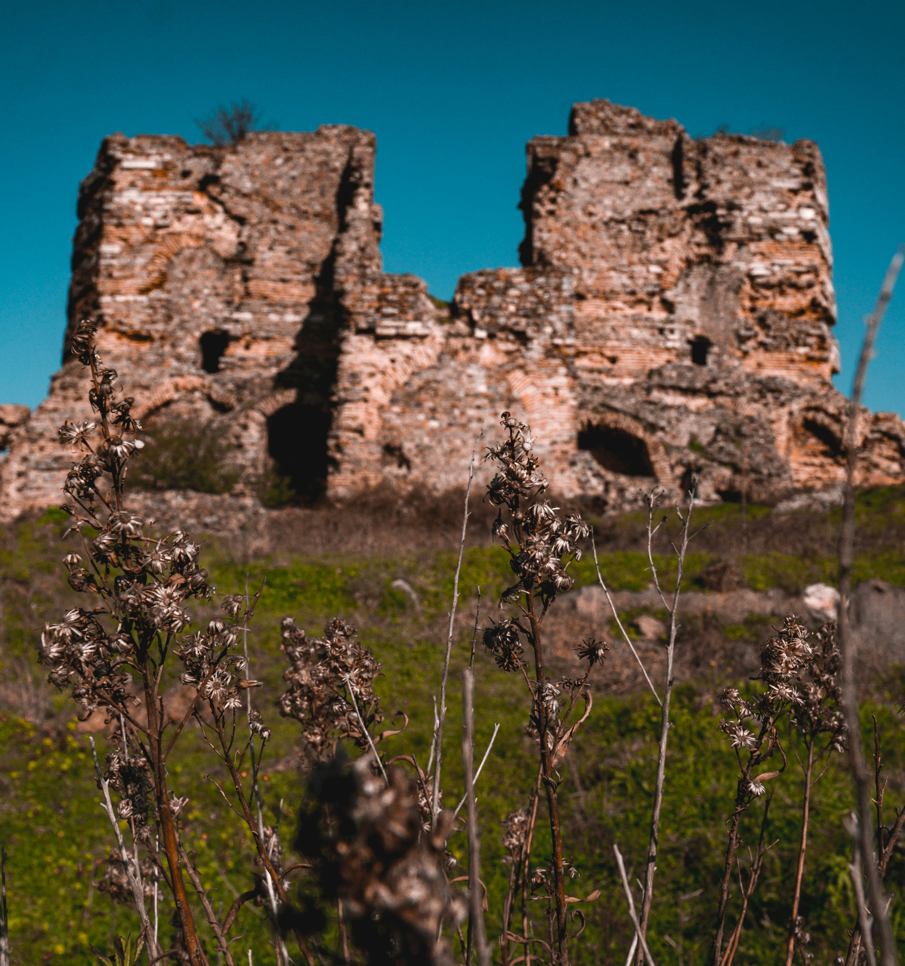 brown brick building under blue sky during daytime