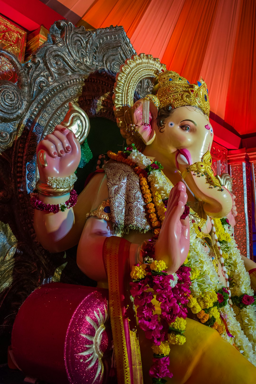 woman in gold and red sari dress