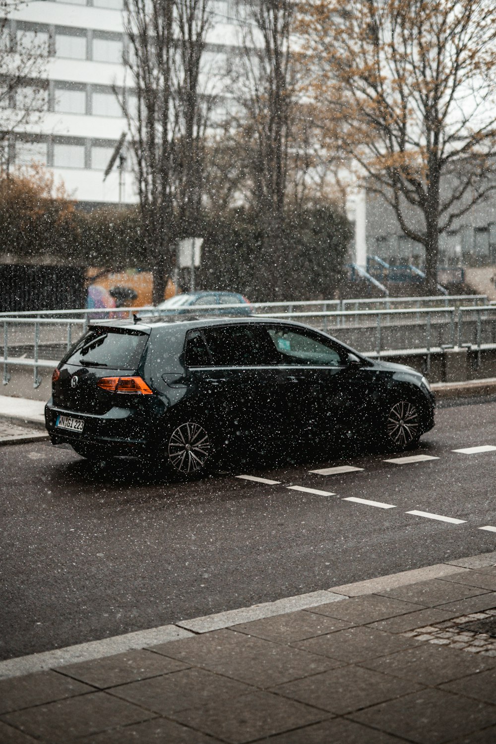 black sedan on road during daytime