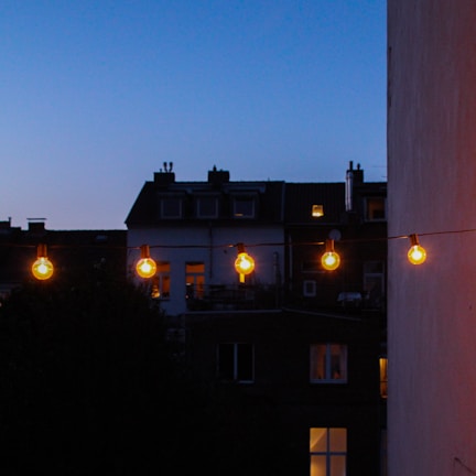 Evening lights glowing warmly in the heart of the neighborhood