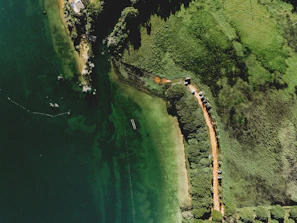 Aerial view of a prime land plot in Veracruz surrounded by lush greenery.