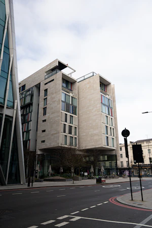 A modern apartment building clad in golden panels