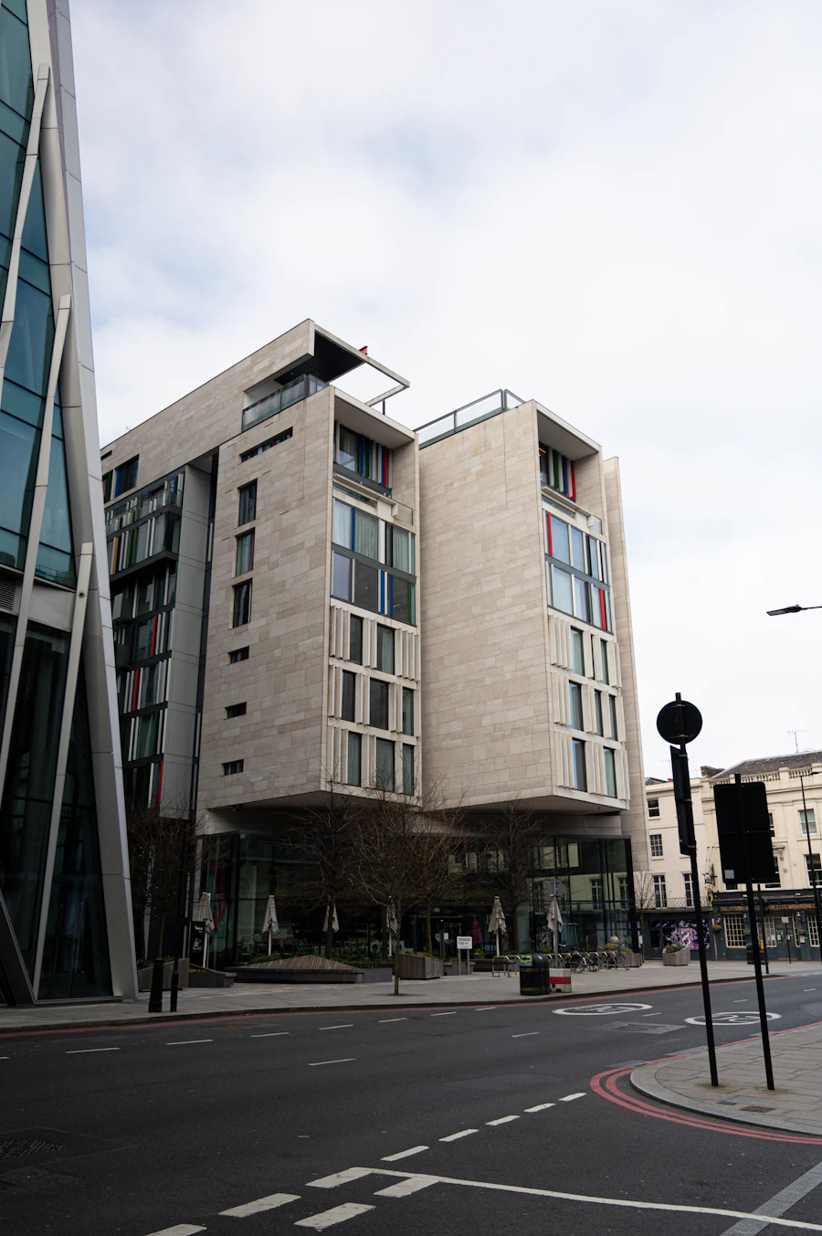 A modern apartment building clad in golden panels