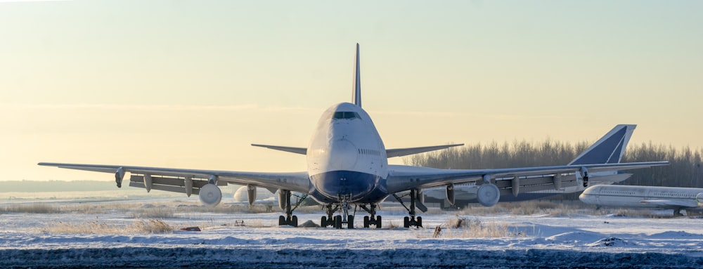 white airplane on the ground during daytime