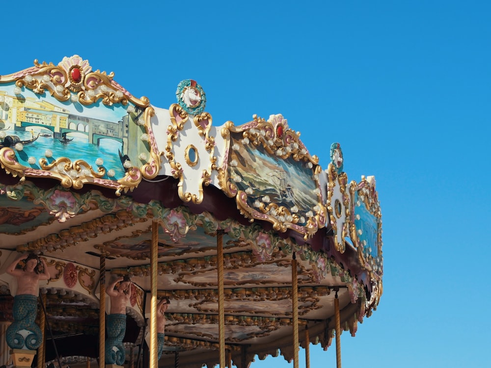 white and brown carousel under blue sky during daytime