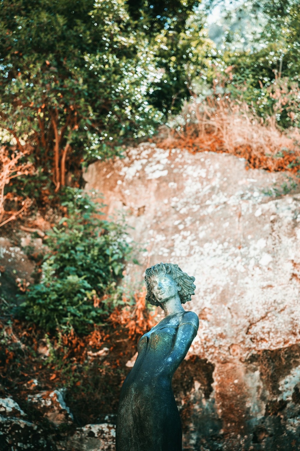 black and blue statue of a woman