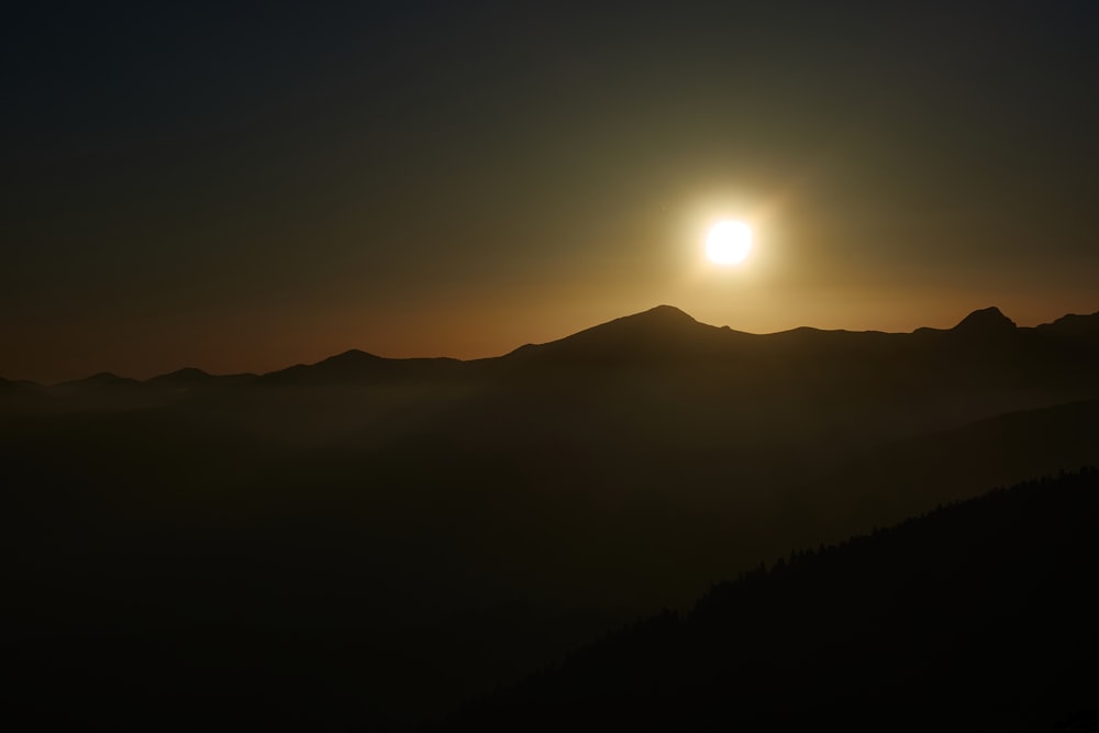 sun over the mountains during sunrise