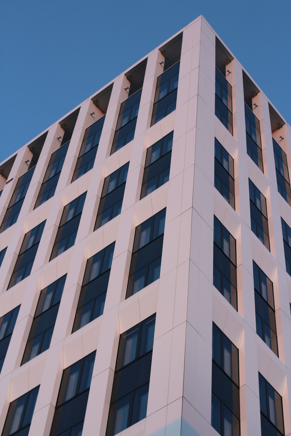 white concrete building under blue sky during daytime