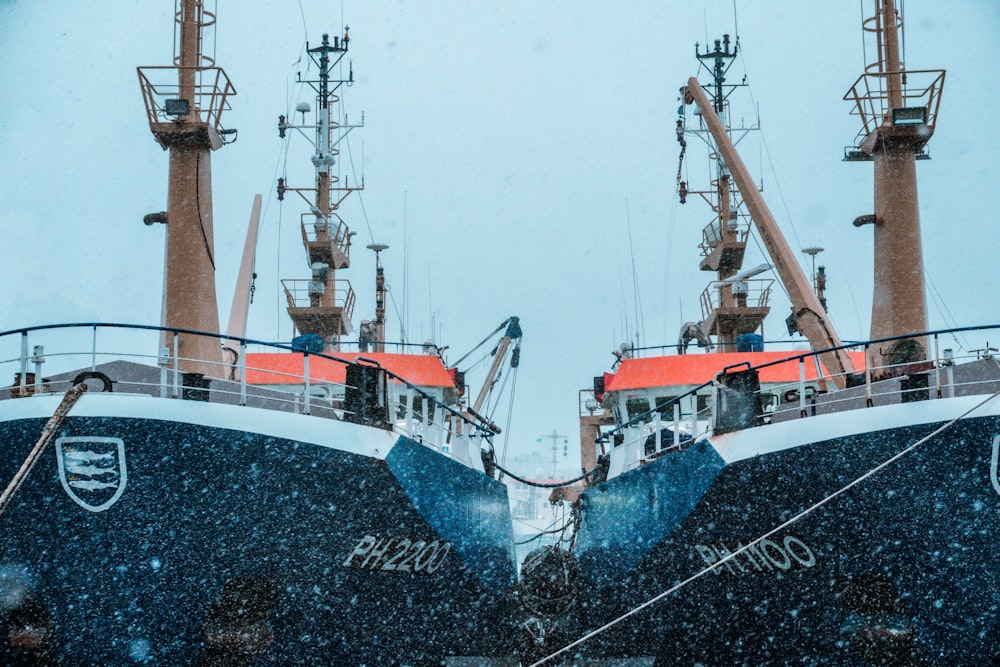 white and blue ship on sea during daytime