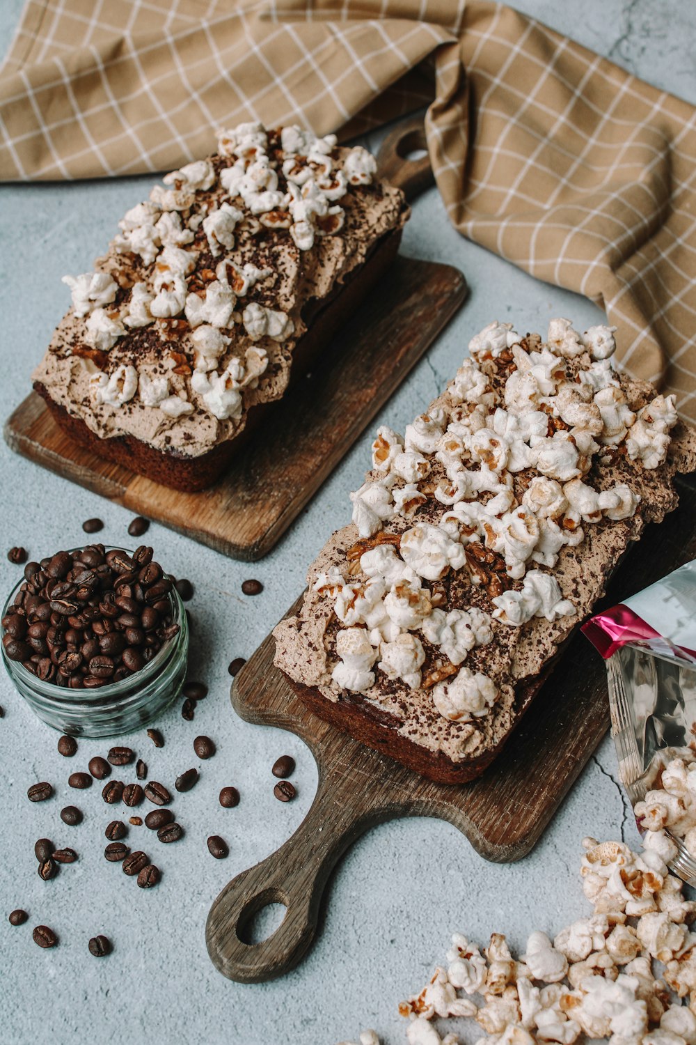 white and brown cake on brown wooden chopping board