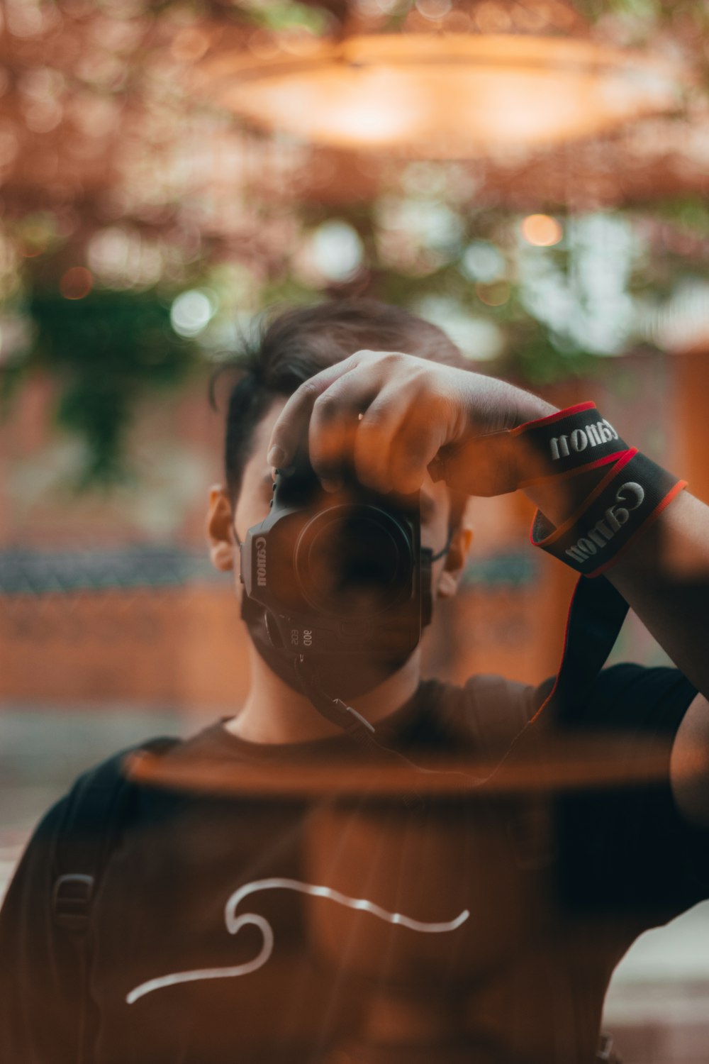 woman in black tank top holding black and red coca cola can