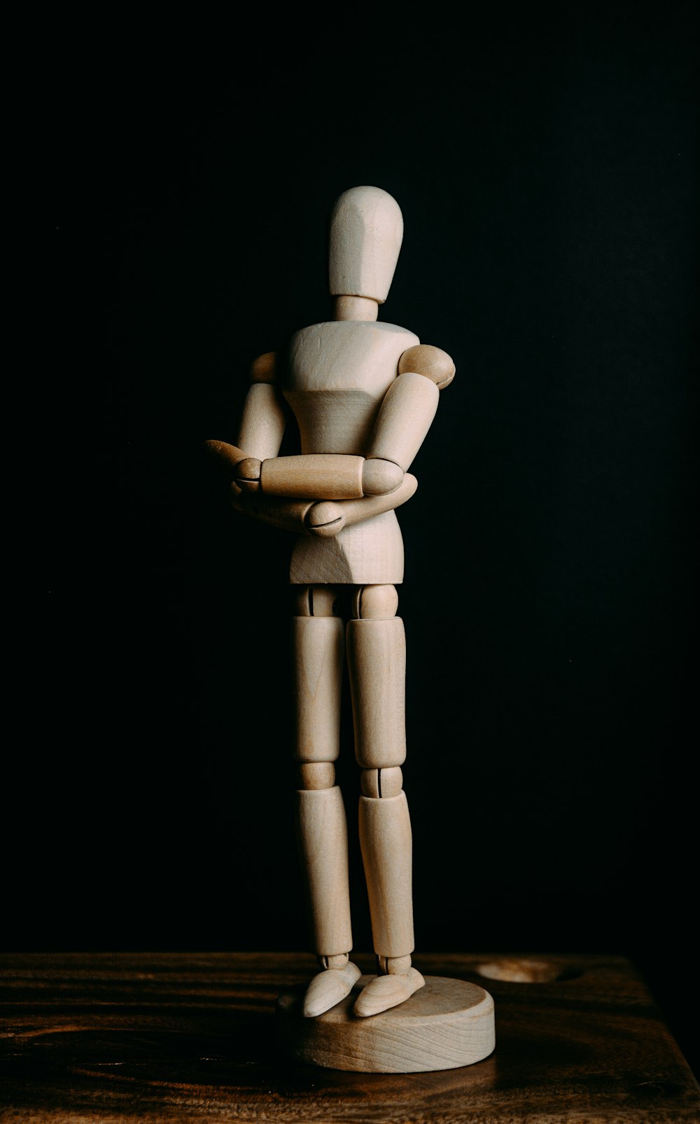 brown wooden human form figurine