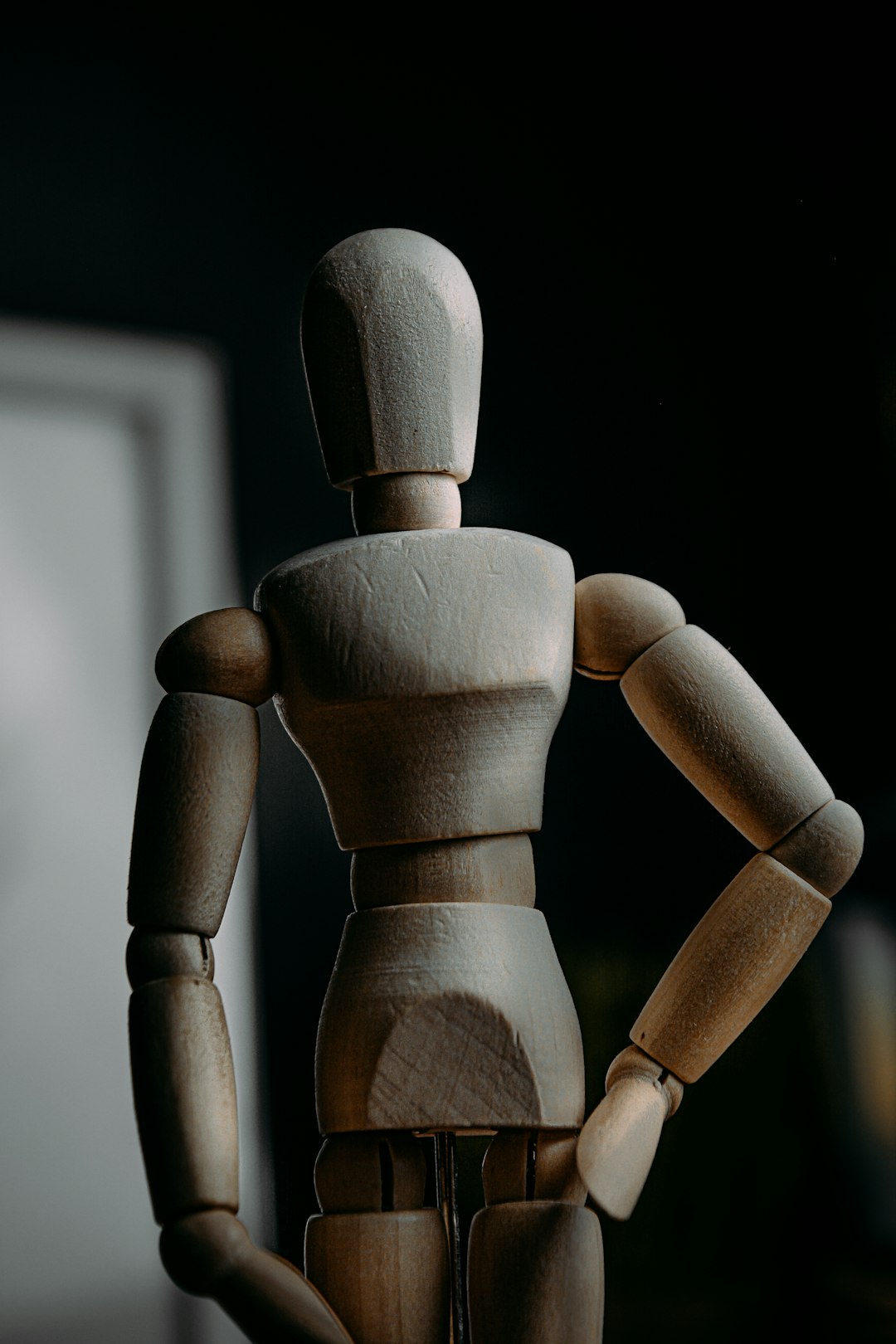 brown wooden human figure on white background