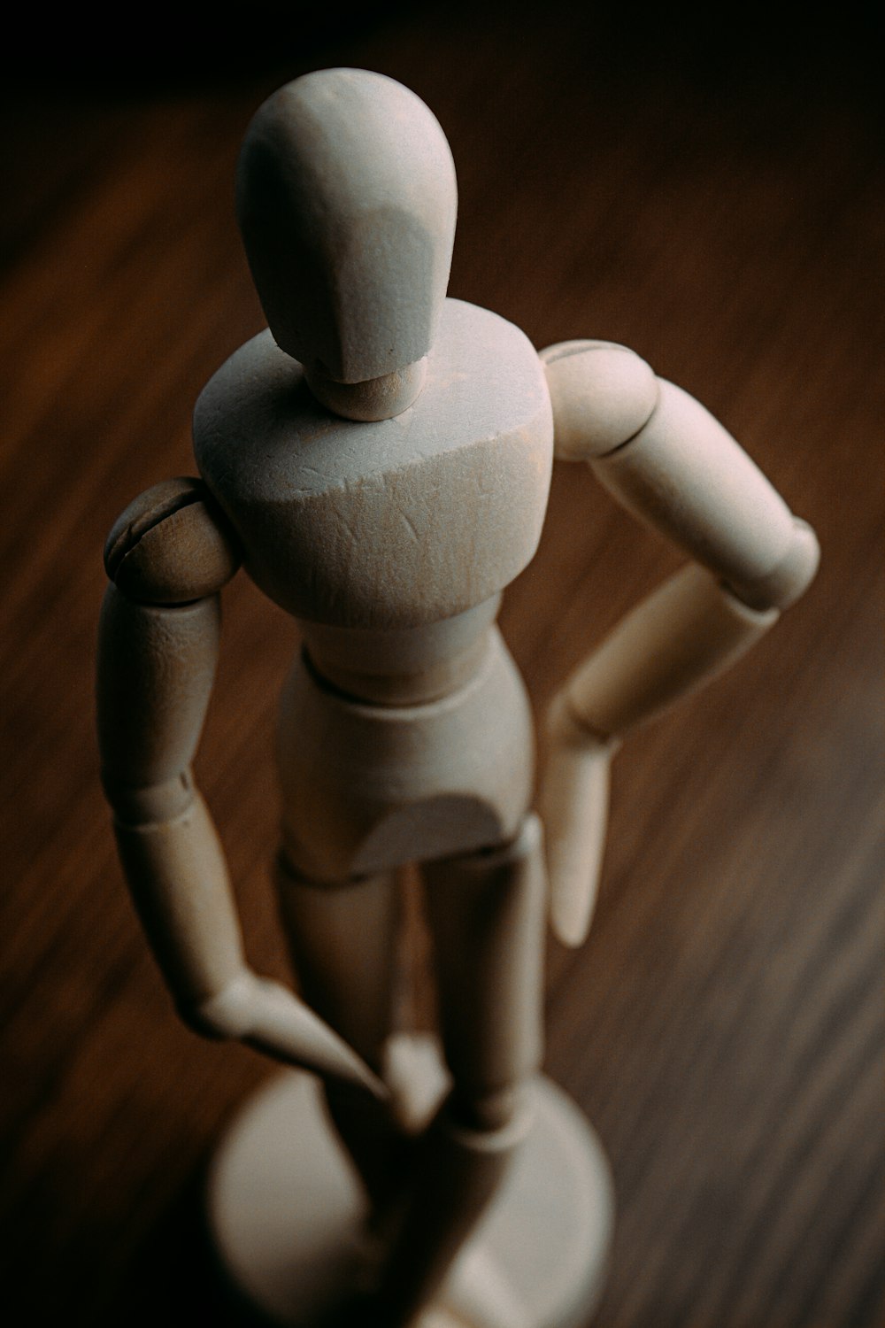 white plastic toy on brown wooden table