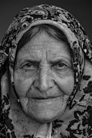 woman in black and white floral hijab