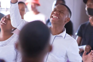 smiling man in white dress shirt