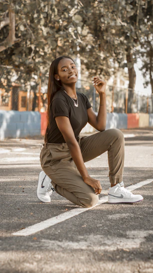 Close-up of a knee support brace in action during a basketball game on a sunlit court