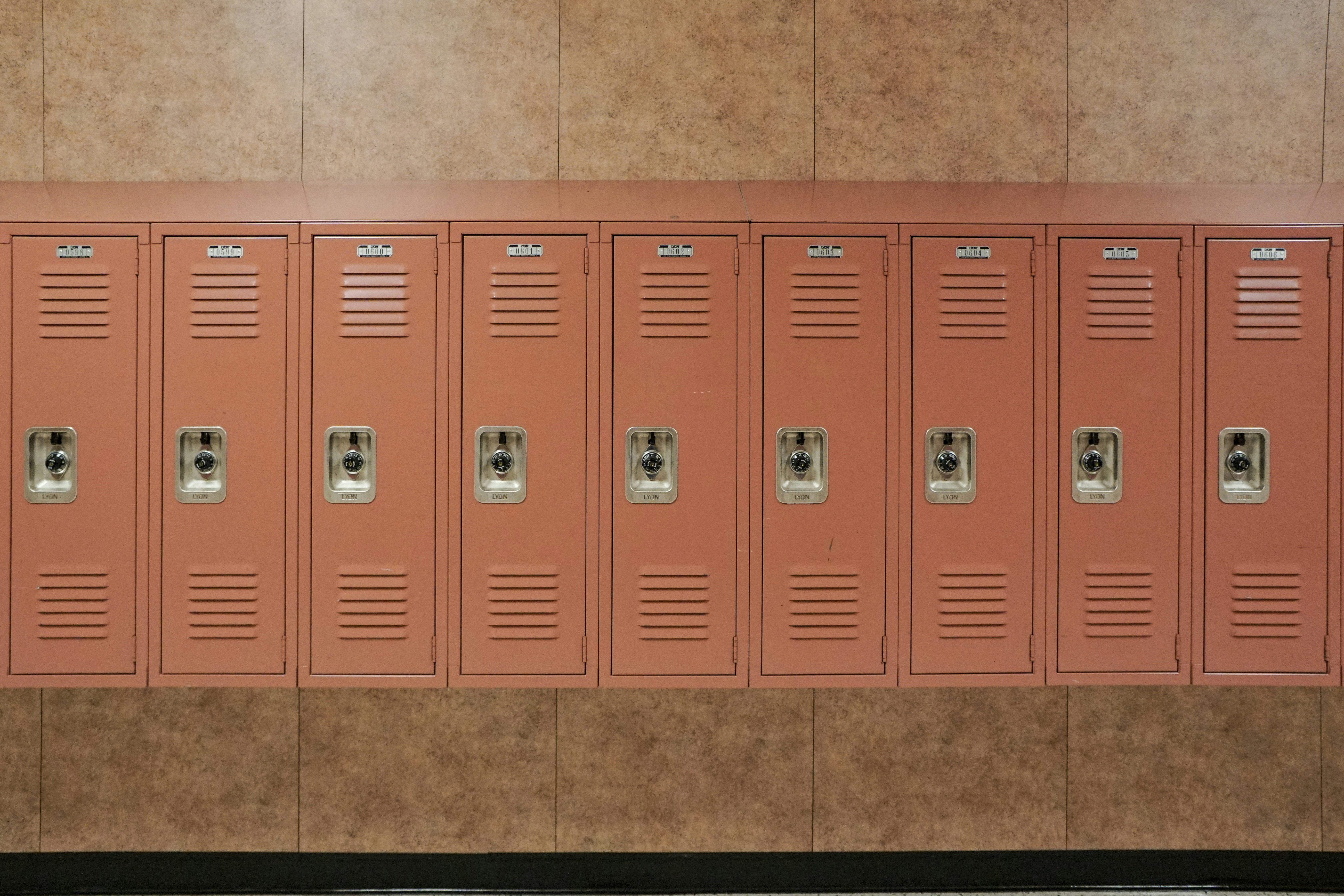 red metal locker on green ceramic tiles