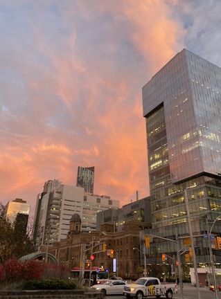 Sunset view of a city skyline with agile transportation routes highlighted.