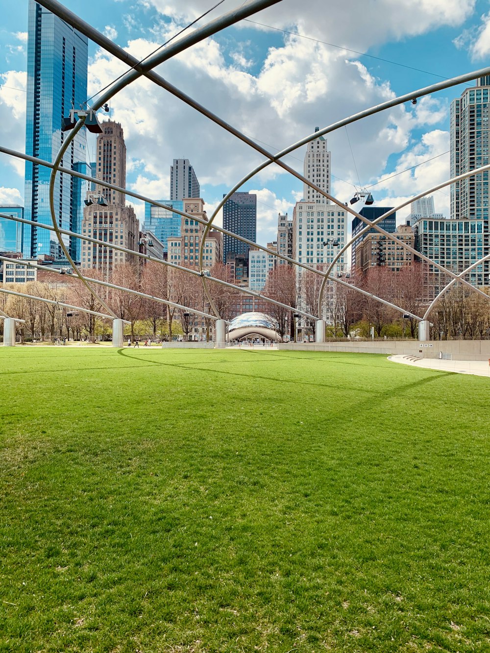 green grass field near white building during daytime