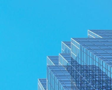 white and blue concrete building under blue sky during daytime