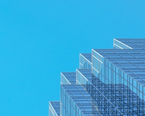 white and blue concrete building under blue sky during daytime