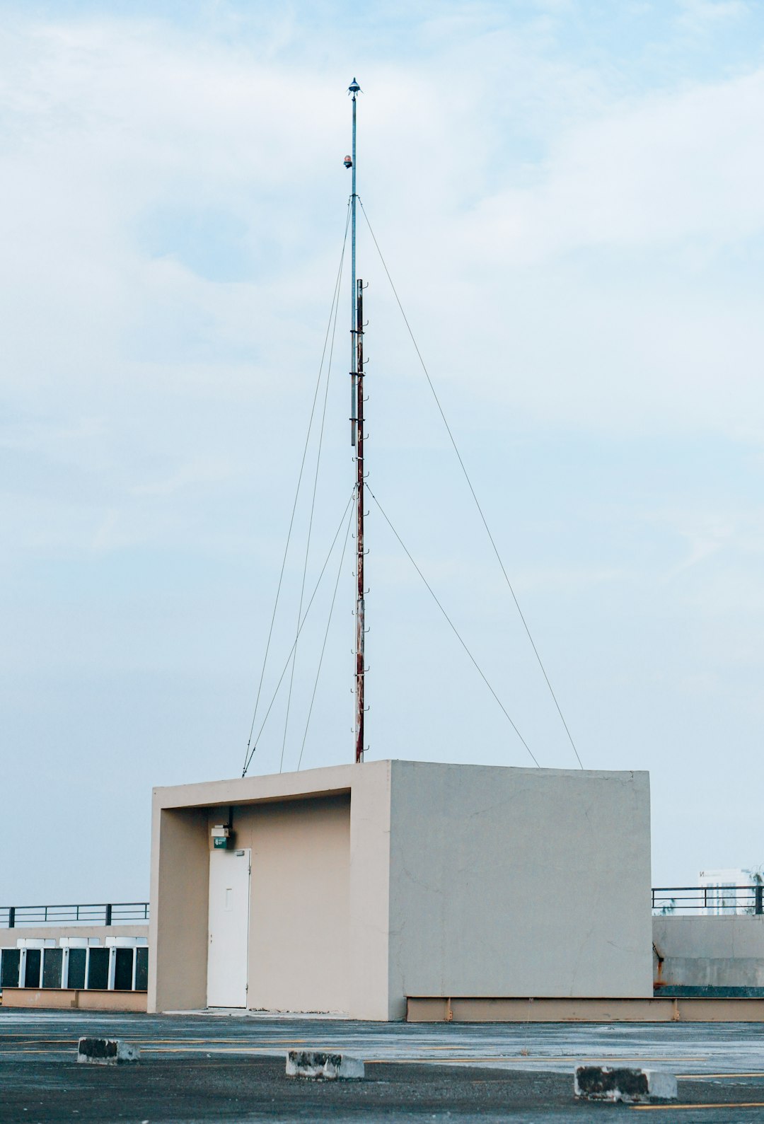 white concrete building under white sky during daytime