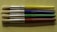 Four paintbrushes are aligned horizontally on a textured, light green surface. Each brush has a metallic ferrule and a brightly colored handle, with colors in yellow, blue, green, and red from top to bottom. The brand name 'CREATIVE PL' is printed on each handle.