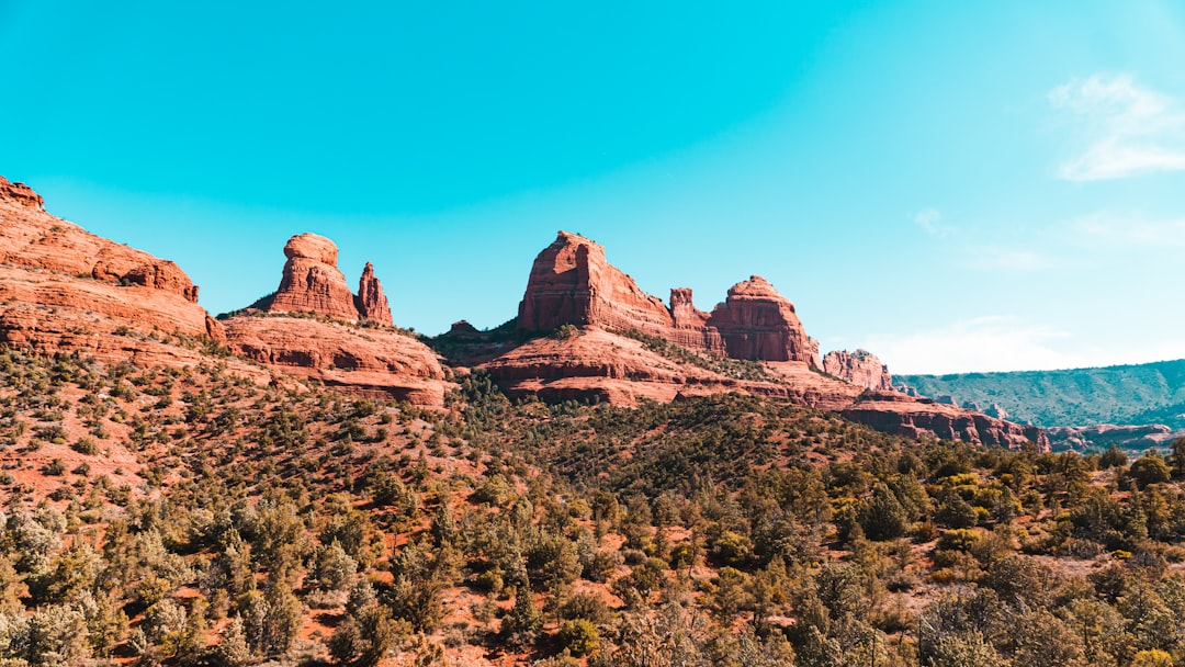 brown rock formation under blue sky during daytime