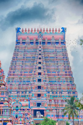 brown and white concrete building under blue sky during daytime