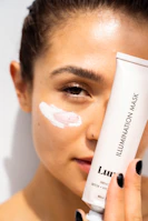 woman with white cream on face