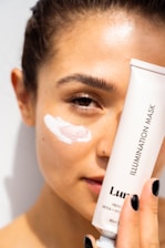 woman with white cream on face