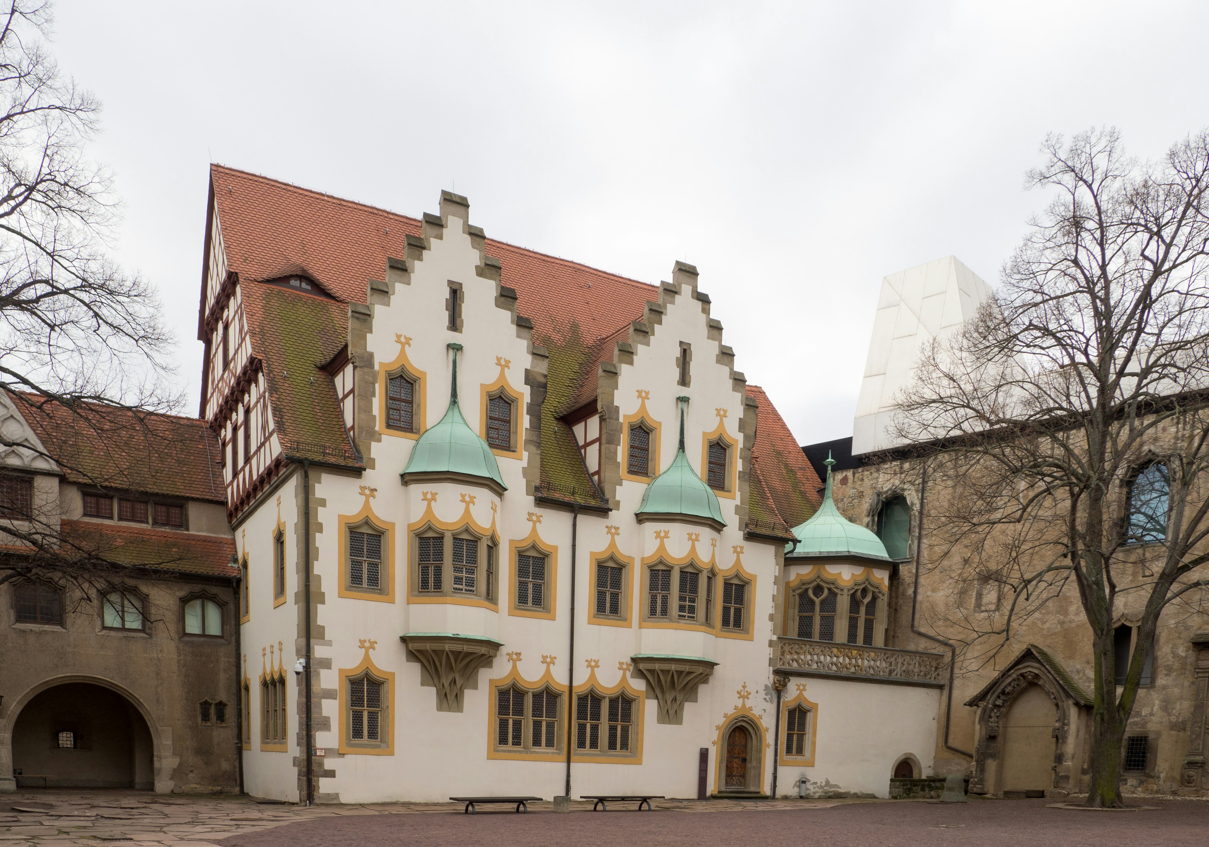 brown and white concrete building under white sky during daytime