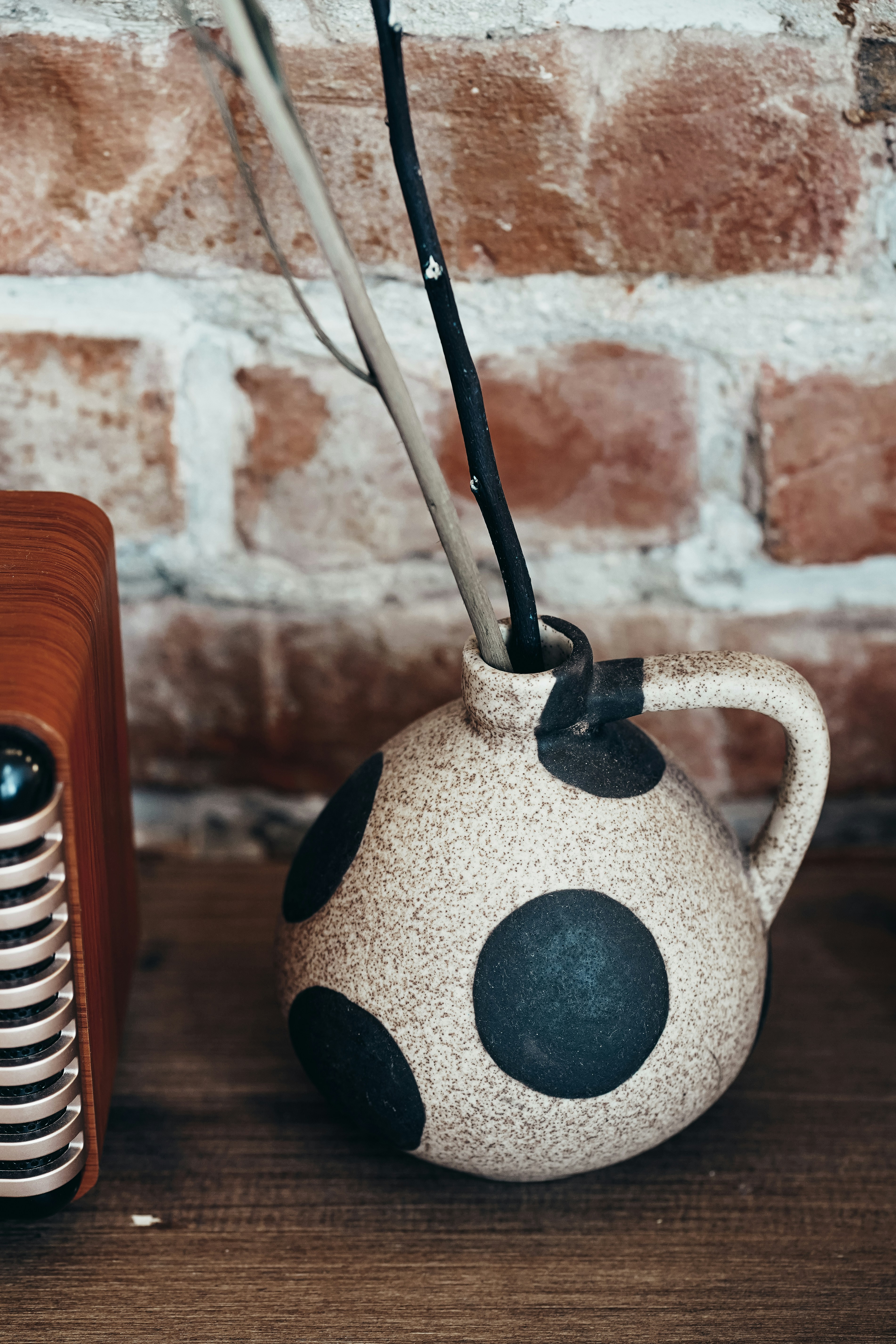 white and black ceramic vase